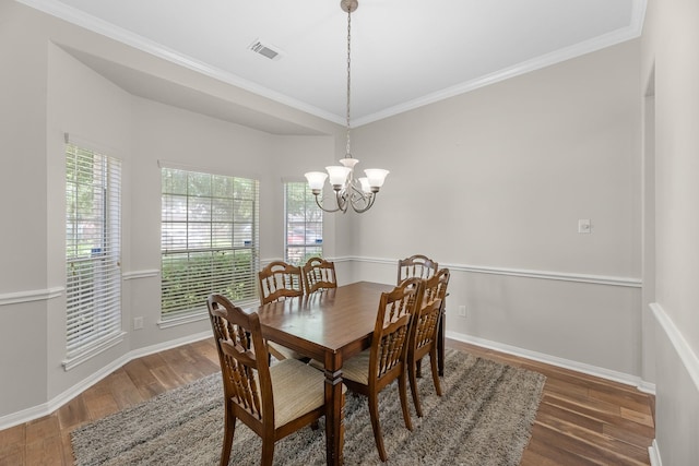 15215 Millers Run Ln, Sugar Land, TX 77498 - dining area featuring wood finished floors, crown molding, and a chandelier