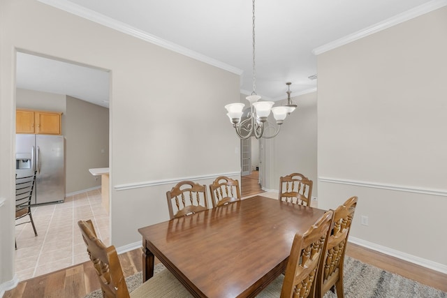 15215 Millers Run Ln, Sugar Land, TX 77498 - dining room with ornamental molding, light wood-type flooring, and a chandelier