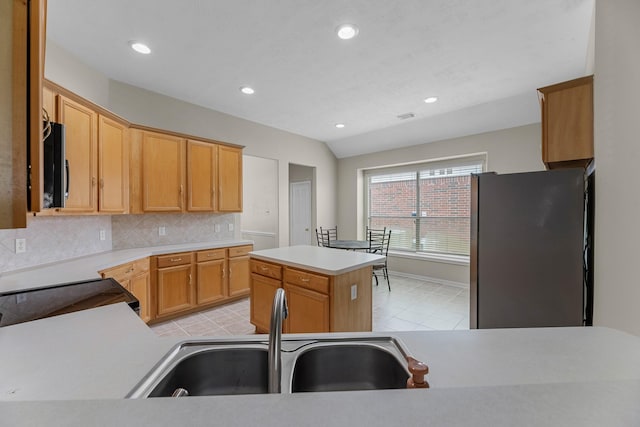 15215 Millers Run Ln, Sugar Land, TX 77498 - kitchen with appliances with stainless steel finishes, tasteful backsplash, light countertops, recessed lighting, and a kitchen island