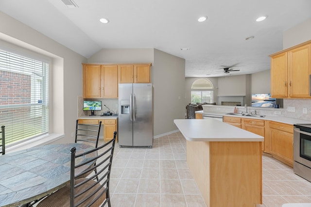 15215 Millers Run Ln, Sugar Land, TX 77498 - kitchen with stainless steel appliances, light brown cabinetry, light countertops, decorative backsplash, and recessed lighting