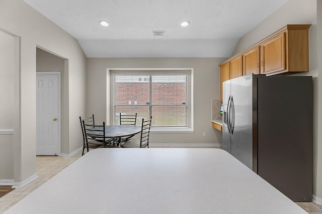 15215 Millers Run Ln, Sugar Land, TX 77498 - kitchen with stainless steel fridge, light countertops, recessed lighting, and vaulted ceiling