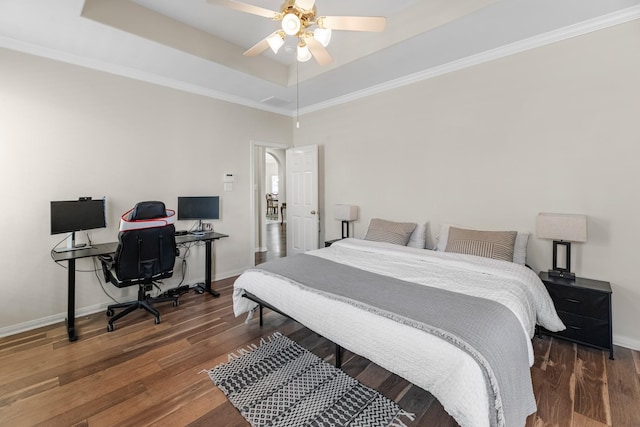 15215 Millers Run Ln, Sugar Land, TX 77498 - bedroom featuring wood finished floors, an office area, a raised ceiling, ceiling fan, and ornamental molding