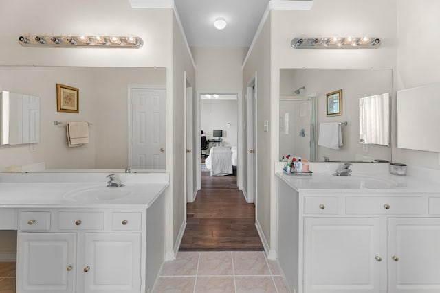 15215 Millers Run Ln, Sugar Land, TX 77498 - full bathroom with a shower stall, two vanities, connected bathroom, and tile patterned flooring
