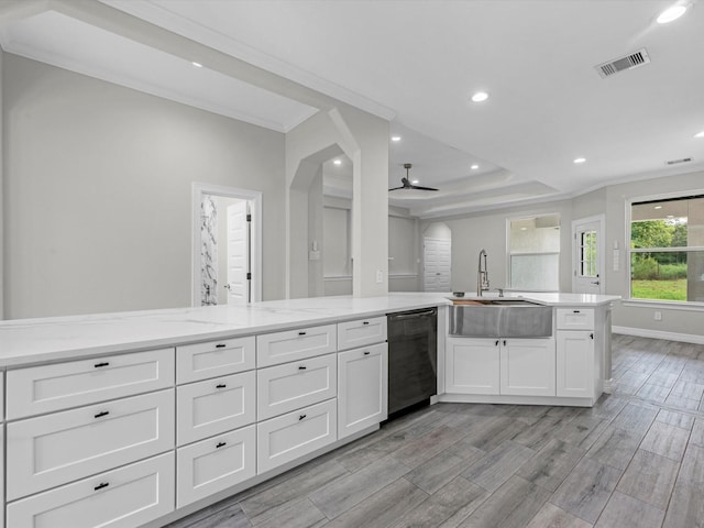 14606 Half Circle St, Splendora, TX 77372 - kitchen with stainless steel dishwasher, ceiling fan, white cabinets, crown molding, and light wood-type flooring