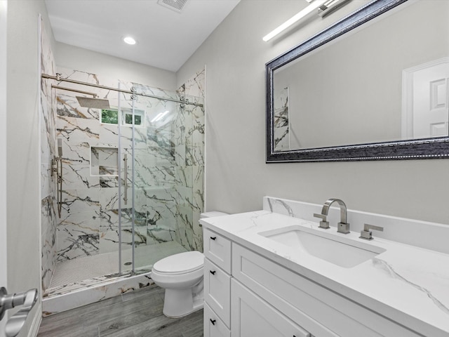 14606 Half Circle St, Splendora, TX 77372 - bathroom featuring vanity, a marble finish shower, and wood finished floors