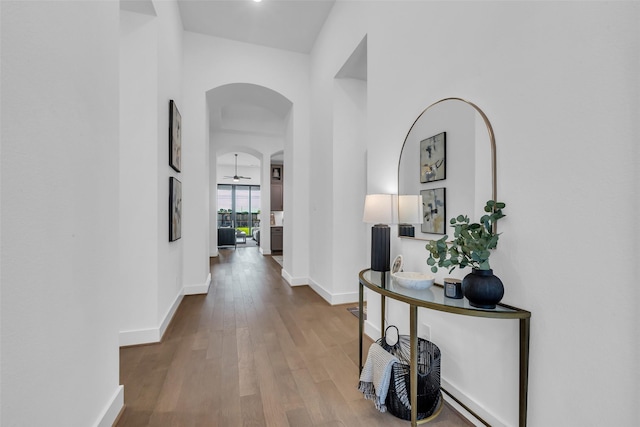 6826 Mirabeau Ln, Katy, TX 77493 - hall with arched walkways and wood finished floors