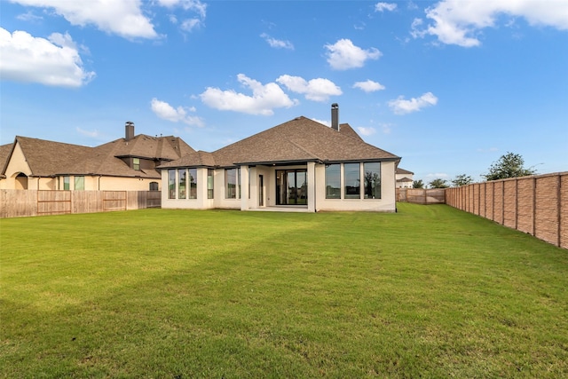 6826 Mirabeau Ln, Katy, TX 77493 - rear view of house with a fenced backyard and stucco siding