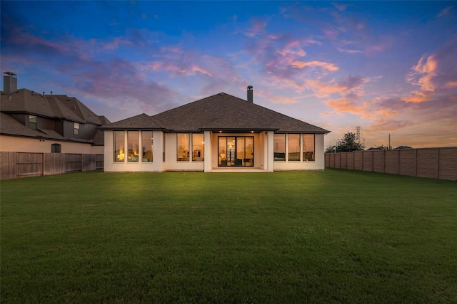 6826 Mirabeau Ln, Katy, TX 77493 - back of house with a fenced backyard, a shingled roof, and a patio area
