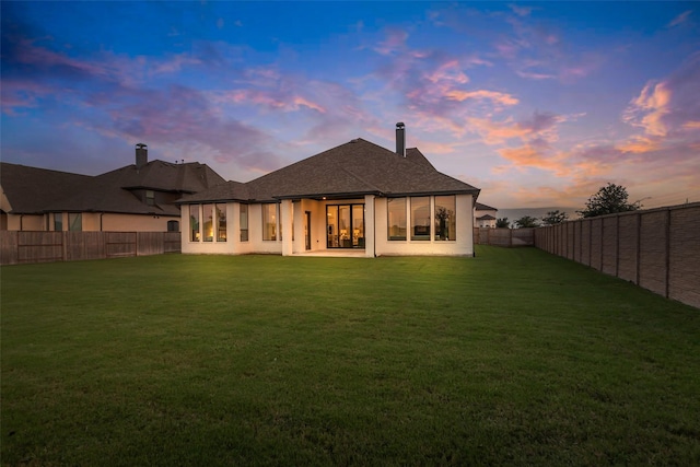 6826 Mirabeau Ln, Katy, TX 77493 - back of property at dusk featuring a fenced backyard and stucco siding