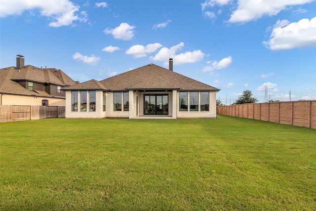 6826 Mirabeau Ln, Katy, TX 77493 - rear view of property featuring a fenced backyard, roof with shingles, and stucco siding