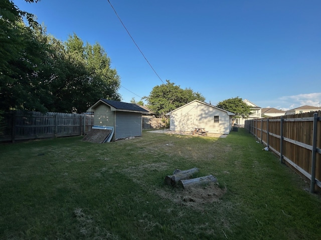 301 Park Pl, College Station, TX 77840 - fenced backyard with a storage unit