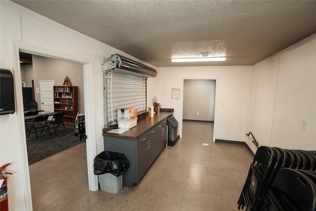 8432 Park Place Blvd, Houston, TX 77017 - kitchen featuring dark countertops and a textured ceiling