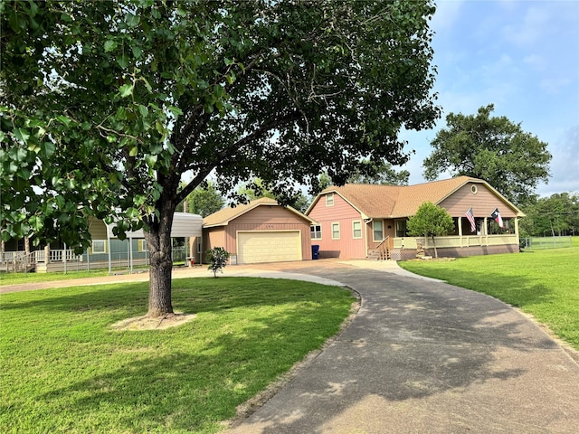 344 Timber Bay Dr, Trinity, TX 75862 - ranch-style house featuring asphalt driveway, a garage, and an outdoor structure