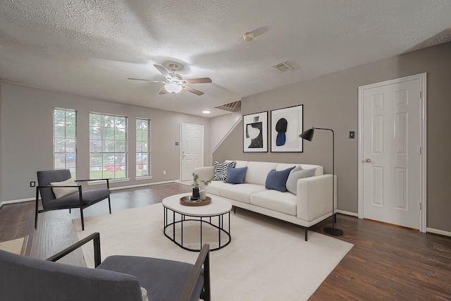 10834 Glenora Dr, Houston, TX 77065 - living room featuring a ceiling fan, wood finished floors, and a textured ceiling