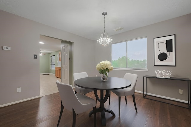 10834 Glenora Dr, Houston, TX 77065 - dining room with plenty of natural light, a chandelier, and dark wood-style flooring