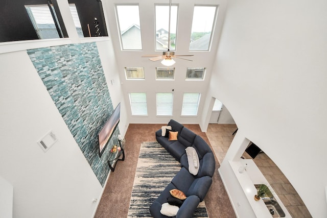 622 Aberhill Dr, Rosharon, TX 77583 - living area with carpet flooring, plenty of natural light, a towering ceiling, and ceiling fan