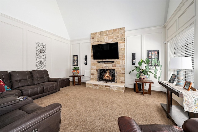 2227 Country Creek Way, Richmond, TX 77406 - living area with a decorative wall, lofted ceiling, carpet flooring, and a stone fireplace