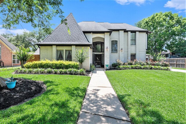 2227 Country Creek Way, Richmond, TX 77406 - french country home featuring brick siding and roof with shingles
