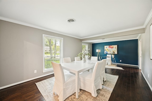 10610 Bordley Dr, Houston, TX 77042 - dining room with crown molding and dark wood-style flooring