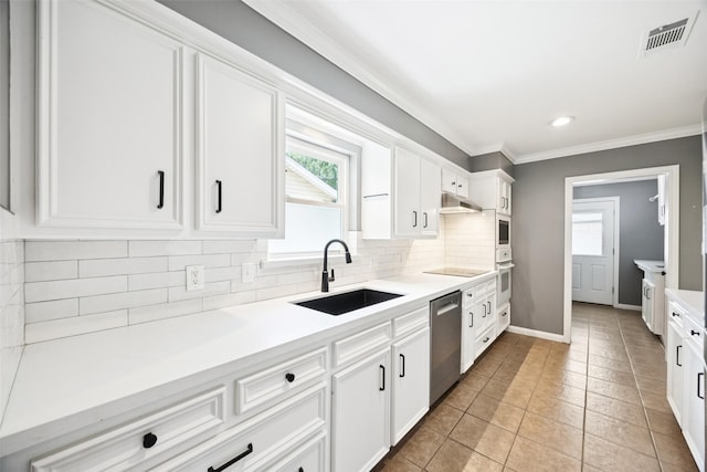 10610 Bordley Dr, Houston, TX 77042 - kitchen featuring white oven, decorative backsplash, white cabinetry, crown molding, and light tile patterned floors