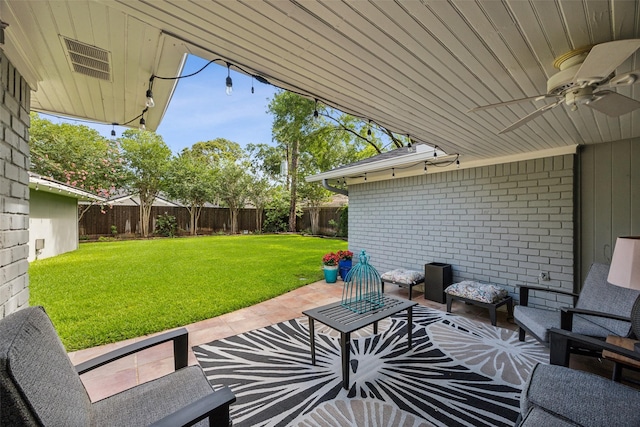 10610 Bordley Dr, Houston, TX 77042 - fenced backyard featuring a patio area and ceiling fan