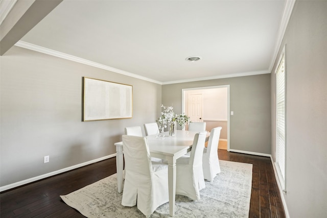 10610 Bordley Dr, Houston, TX 77042 - dining space with ornamental molding and dark wood-style floors