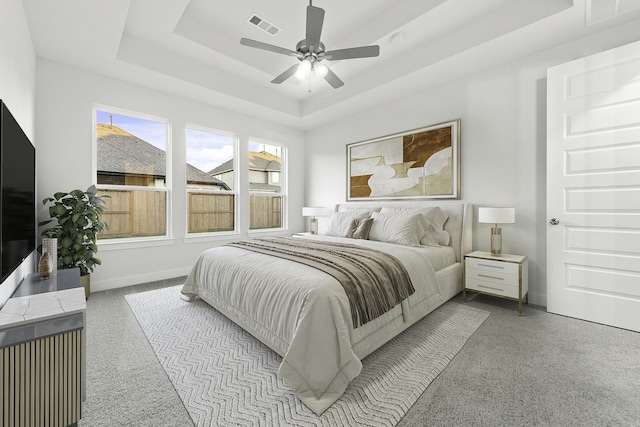 5029 Steady Breeze Dr, Katy, TX 77493 - bedroom featuring a tray ceiling and a ceiling fan