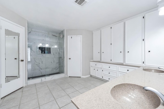 12710 Ashford Pine Dr, Houston, TX 77082 - bathroom with a marble finish shower, tile patterned floors, and double vanity