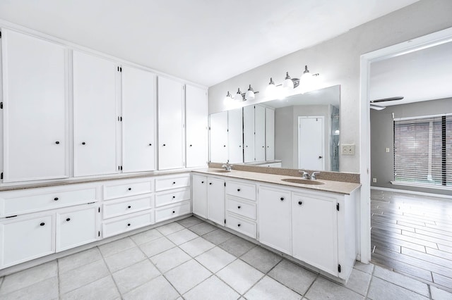 12710 Ashford Pine Dr, Houston, TX 77082 - full bath with double vanity, tile patterned floors, and ceiling fan