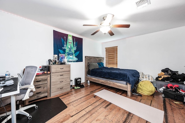 12710 Ashford Pine Dr, Houston, TX 77082 - bedroom with an office area, hardwood / wood-style flooring, and ceiling fan
