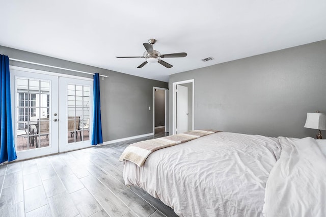 12710 Ashford Pine Dr, Houston, TX 77082 - bedroom featuring french doors, access to exterior, wood finished floors, and a ceiling fan