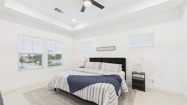 2712 Jensen Creek Ln, Houston, TX 77026 - carpeted bedroom featuring a raised ceiling, a ceiling fan, and recessed lighting