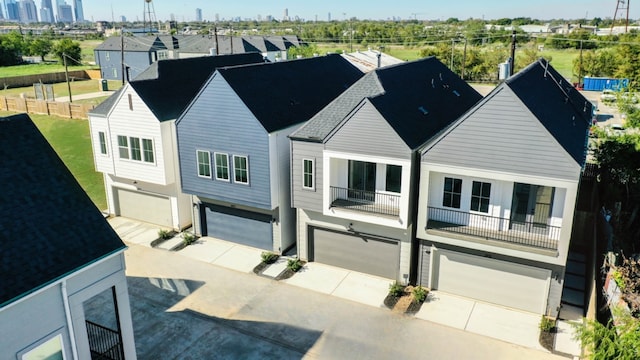 2712 Jensen Creek Ln, Houston, TX 77026 - view of front facade featuring an attached garage and driveway
