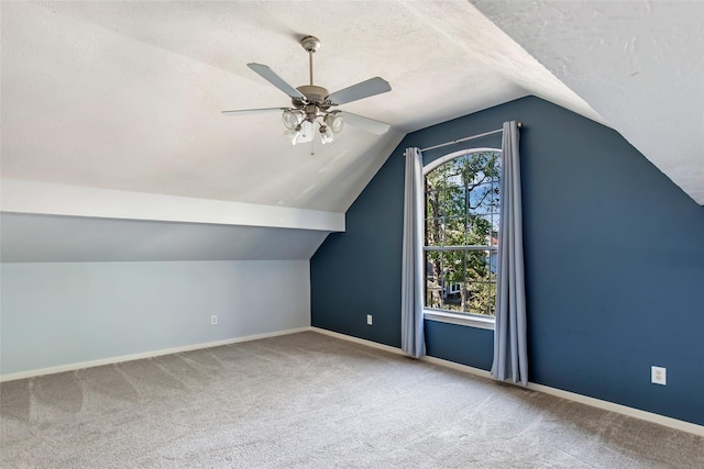 19002 Volley Vale Ct, Humble, TX 77346 - bonus room with carpet flooring, lofted ceiling, a ceiling fan, and a textured ceiling