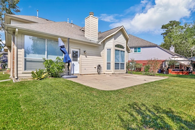 19002 Volley Vale Ct, Humble, TX 77346 - rear view of property with a patio, a chimney, a yard, and roof with shingles