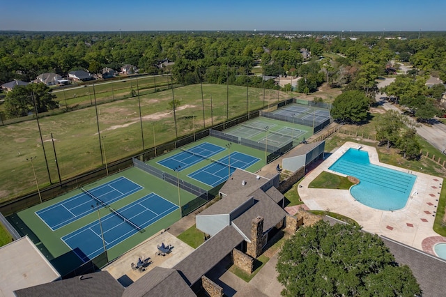 19002 Volley Vale Ct, Humble, TX 77346 - bird's eye view of a pool area and a heavily wooded area