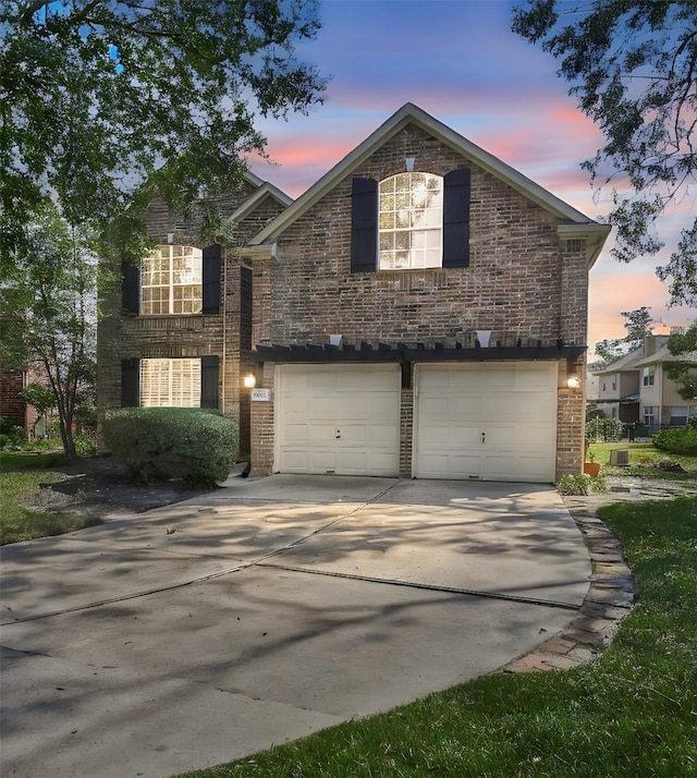 19002 Volley Vale Ct, Humble, TX 77346 - traditional-style house with brick siding, an attached garage, and concrete driveway