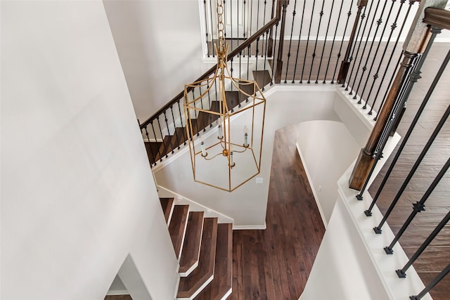 19002 Volley Vale Ct, Humble, TX 77346 - stairway with wood finished floors and a chandelier