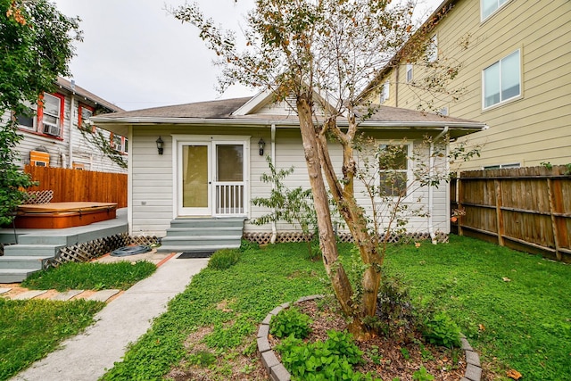 90 Dennis St, Houston, TX 77006 - view of front facade featuring a hot tub and entry steps