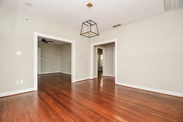 90 Dennis St, Houston, TX 77006 - empty room with wood finished floors and a chandelier