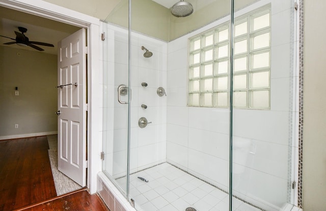 90 Dennis St, Houston, TX 77006 - full bath with a stall shower, ceiling fan, and wood finished floors