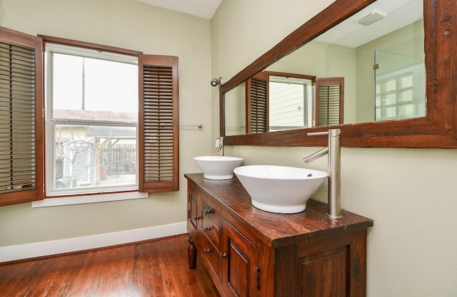 90 Dennis St, Houston, TX 77006 - full bath with plenty of natural light, wood finished floors, and double vanity