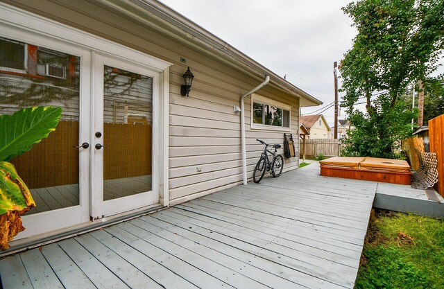 90 Dennis St, Houston, TX 77006 - wooden deck with a covered hot tub and french doors
