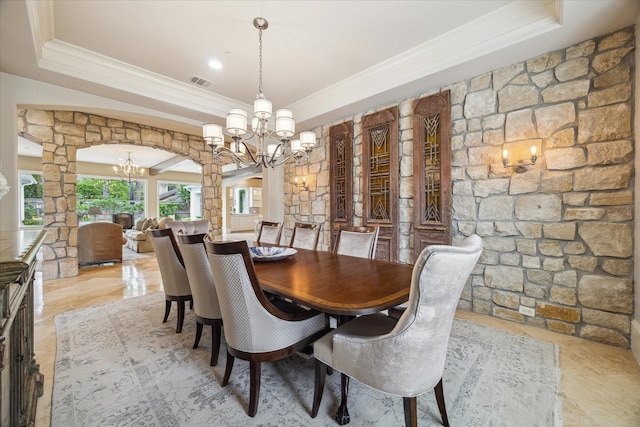 2 Burkhart Forest Ct, Spring Valley Village, TX 77055 - dining space with a chandelier, ornate columns, crown molding, a raised ceiling, and arched walkways