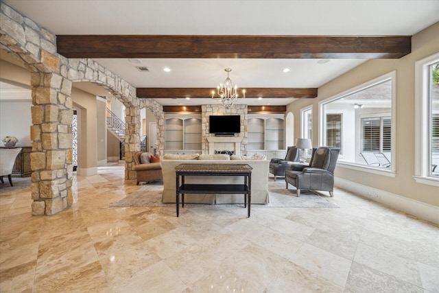 2 Burkhart Forest Ct, Spring Valley Village, TX 77055 - living area with arched walkways, decorative columns, beamed ceiling, a chandelier, and a fireplace