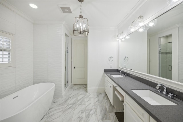 2 Burkhart Forest Ct, Spring Valley Village, TX 77055 - bathroom featuring double vanity, a stall shower, a freestanding bath, a chandelier, and ornamental molding