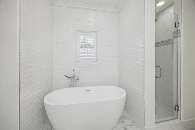 2 Burkhart Forest Ct, Spring Valley Village, TX 77055 - full bath featuring marble look tile flooring, a shower stall, a freestanding tub, tile walls, and ornamental molding