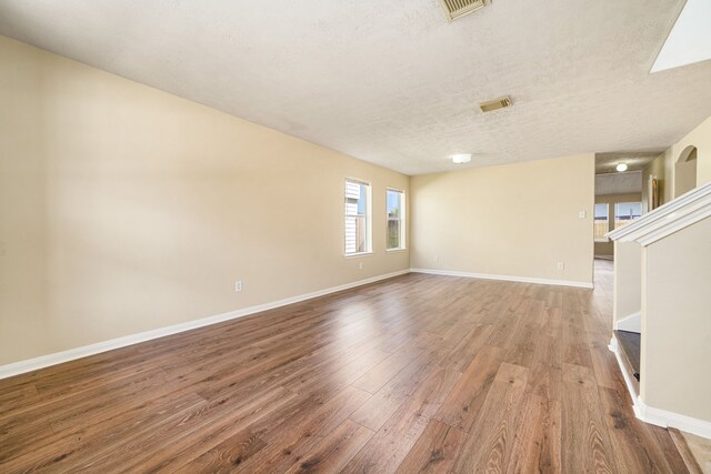 3434 Fiorella Way, Humble, TX 77338 - spare room with wood-type flooring and a textured ceiling