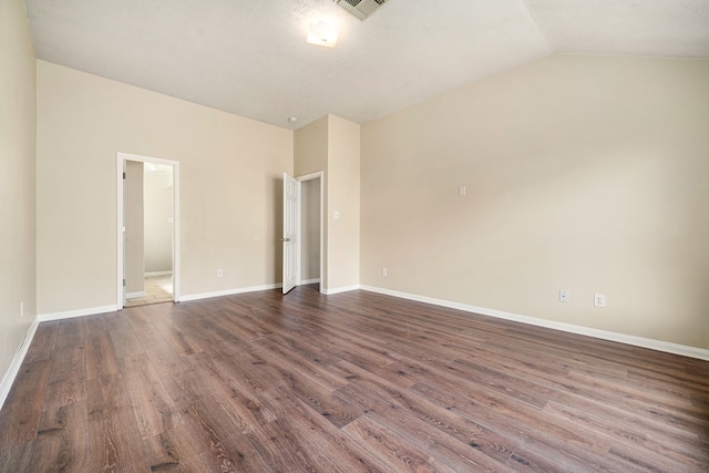 3434 Fiorella Way, Humble, TX 77338 - spare room featuring dark wood-style flooring and vaulted ceiling