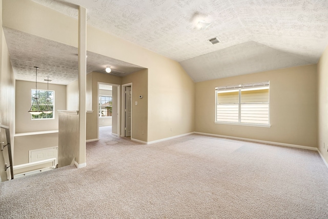 3434 Fiorella Way, Humble, TX 77338 - carpeted spare room featuring a textured ceiling and vaulted ceiling